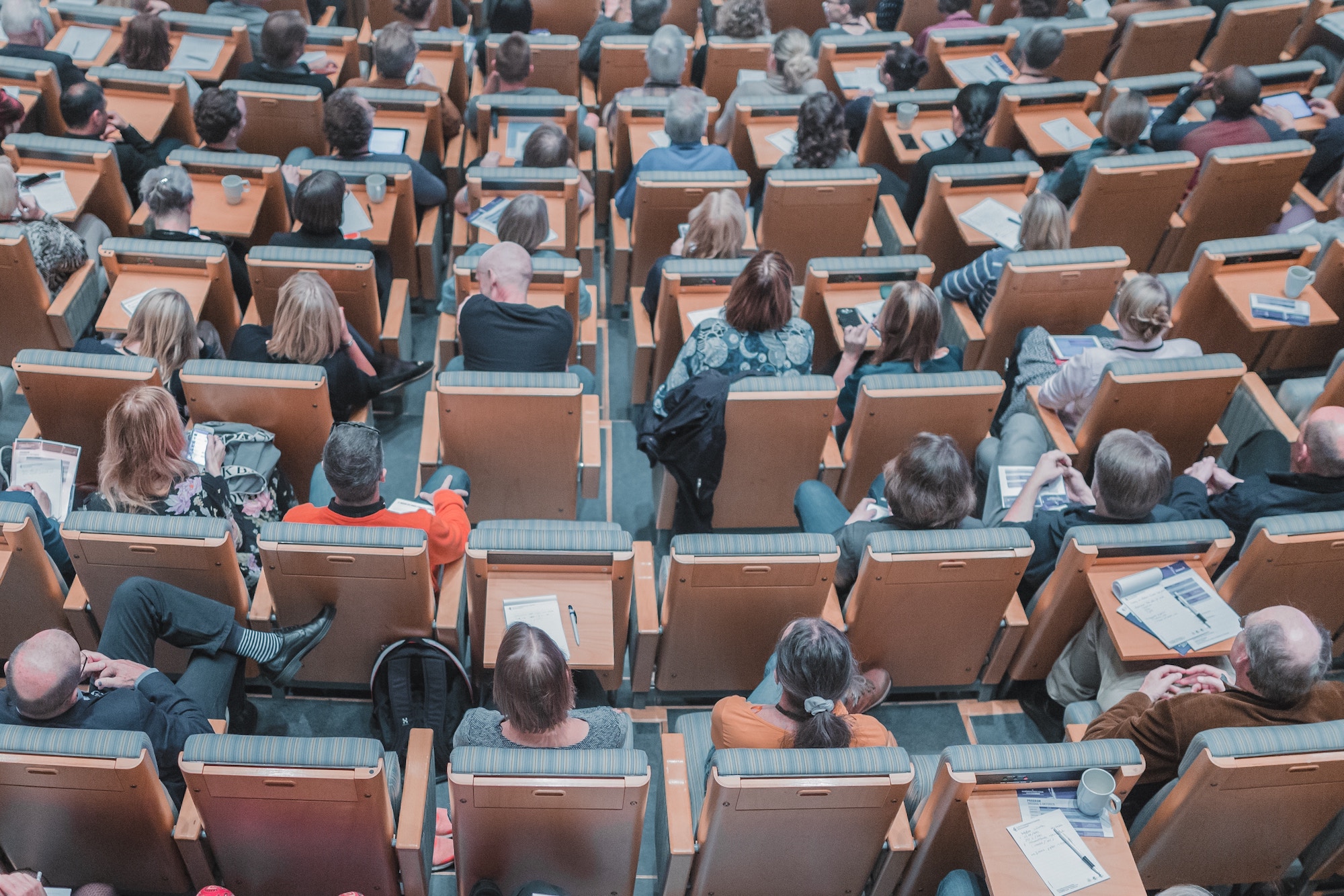 image of community coalition meeting group seated in auditorium from overhead