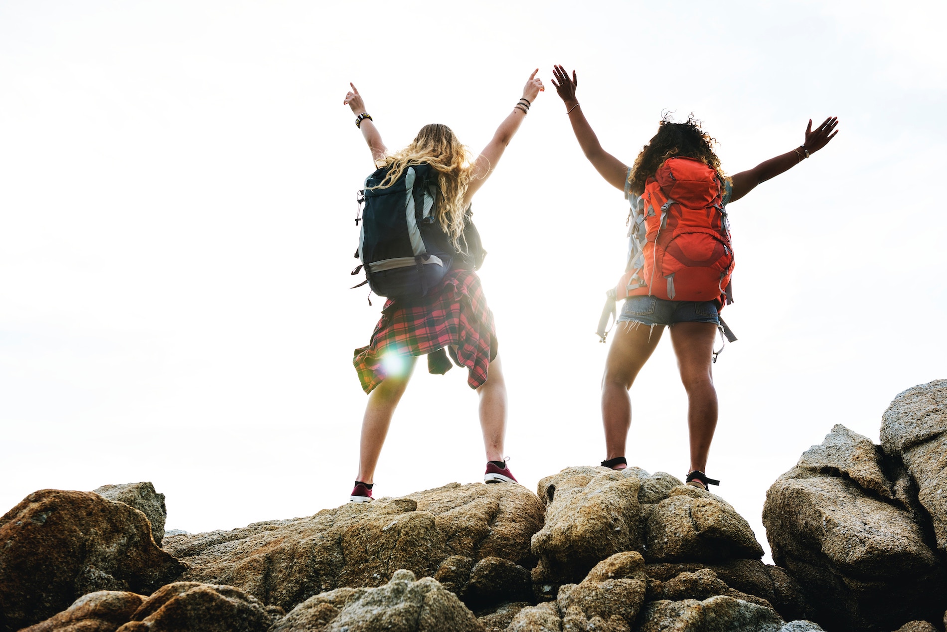 two girls enjoying outdoor program for youth empowerment on a mountain top